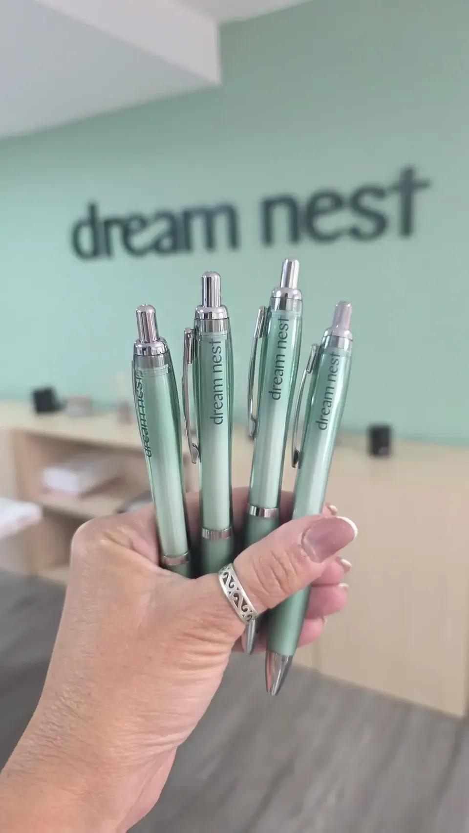 Dream Nest branded pen on a desk